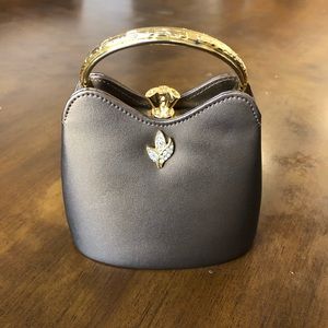 Gold embellished clutch